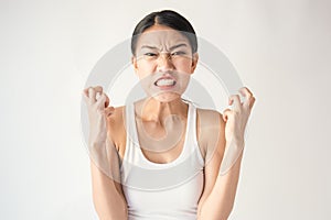 Portrait of angry pensive mad crazy asian woman screaming out expression, facial