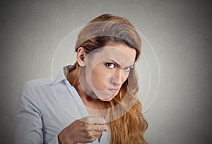 Portrait angry woman on grey background. Negative emotion