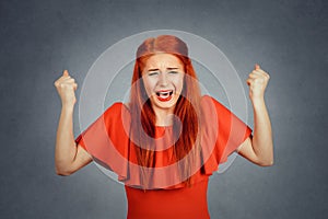 Portrait angry woman screaming wide open mouth hysterical