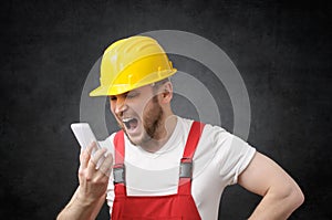 Construction worker shouting on the phone