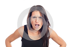 Portrait of angry young brunette woman screaming