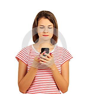 Portrait angry young girl looking at phone seeing bad news or photos with disgusting emotion on her face. emotional girl isolated