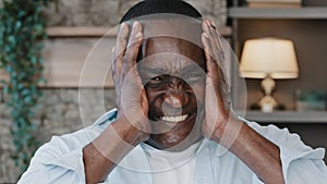 Portrait of annoyed african american adult man angry furious senior elder businessman shouts NO covers ears with hands
