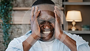 Portrait of annoyed african american adult man angry furious senior elder businessman shouts NO covers ears with hands