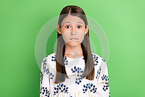 Portrait of anxious horrified schoolkid bite lips worry spring study exam  over green color background