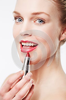 Portrait, application and model in studio with red lipstick, beauty cosmetics and mock up by white background. Woman