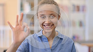 Portrait of Appreciative African Woman showing Ok Sign