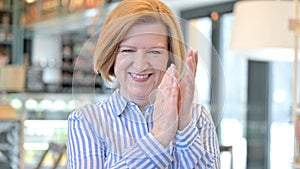 Portrait of Appreciative Creative Old Woman Clapping