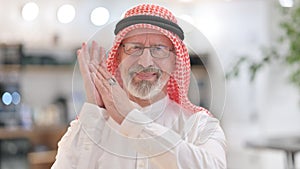 Portrait of Appreciative Senior Old Arab Businessman Clapping