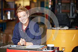 Portrait Of Apprentice Engineer In Factory