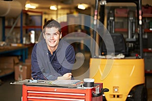Portrait Of Apprentice Engineer In Factory photo