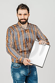 Portrait of an Arab man holding a white blank panel with space for text. On white background