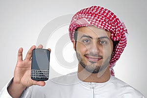 Portrait of an Arabian business man holding a phone for presentation