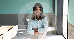 Portrait of Arabic business woman posing at workplace