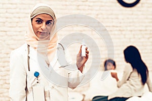 Portrait Arabic Female Doctor Holding Medicament