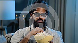 Portrait arabic hispanic latino indian muslim bearded man in 3d glasses watching TV relaxed guy in virtual eyeglasses