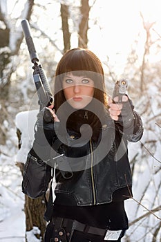 Portrait of armed beautiful young lady