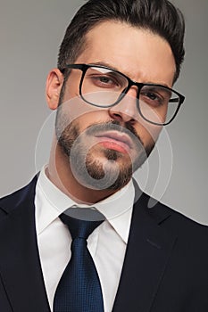 Portrait of arrogant businessman wearing eyeglasses
