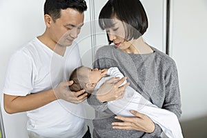 Portrait of asain family in living room