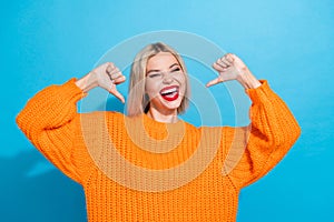 Portrait of asertiive confident cool woman with bob hair dressed knitwear sweater indicating at herself isolated on blue