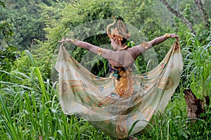 Portrait of Asia dancer at outdoor in rainforest