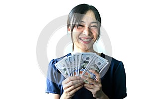 Portrait Asia smiling woman with dollars in hand,happy to have money concept