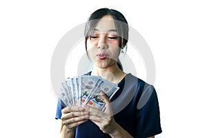 Portrait Asia smiling woman with dollars in hand,happy to have money concept