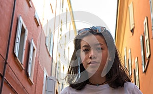 Portrait of Asian American teen with sunglasses on her head