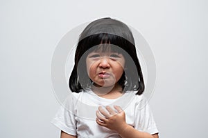 Portrait of Asian angry, sad and cry little girl on white isolated background, The emotion of a child when tantrum and mad,