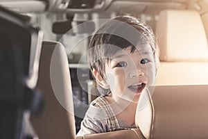 Portrait Asian Baby Boy Smile in Luxury Car.