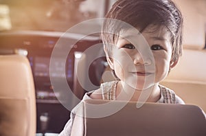 Portrait Asian Baby Boy Smile in Luxury Car with Space for text.