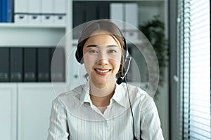 Portrait of Asian beautiful business woman smile while work in office. Attractive professional female employee worker in formal