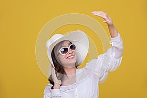 Portrait Asian beautiful happy young woman with sunglasses and hat smiling cheerful in summer and looking at camera isolated on