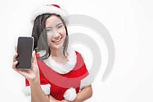 Portrait of asian beautiful woman wearing santa custume with her hand holding mobil phon photo