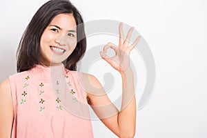 Portrait Asian beautiful young woman made finger OK symbol sign