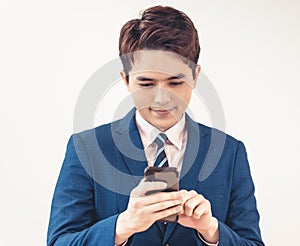 Portrait of asian  businessman using mobile phone.