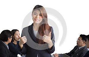 Portrait of Asian businesswoman standing in front of her team at office, female leader