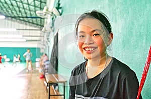 Portrait of Asian child girl at Badminton gym