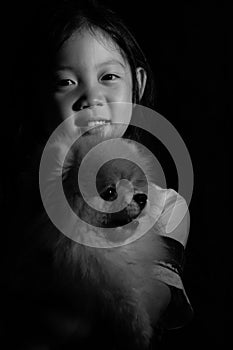 Portrait Asian Child Holding Dog in Black and White