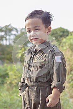 Portrait of asian children wearing airforce pilot suit toothy sm