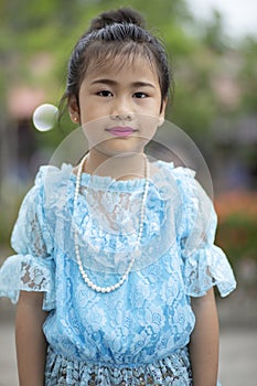 portrait of asian children wearing thai traditon clothes standing outdoor