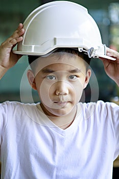 Portrait of asian children and white safety helmet