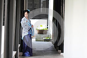 Portrait of Asian Chinese girl in traditional dress, wear blue and white porcelain style Hanfu