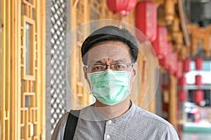 Portrait of Asian Chinese man wearing surgical face mask
