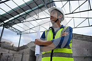 Portrait of Asian Civil Engineer People, Consulting in building structure at construction site holding the paper drawing in his