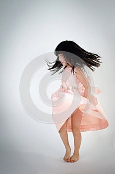 Portrait of asian cute gril is dancing photo