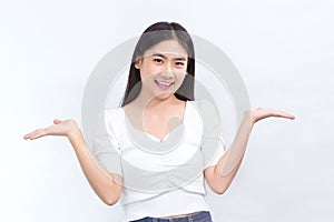 Portrait Asian cute woman is smiling and shows her hands to present something on the white background