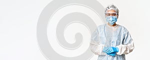 Portrait of asian doctor or nurse in ppe, personal protective equipment, standing in confident, ready pose, white