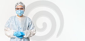 Portrait of asian doctor or nurse in ppe, personal protective equipment, standing in confident, ready pose, white