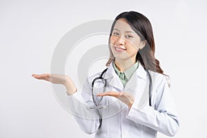 Portrait of asian female doctor smiling and holding her hands sideways